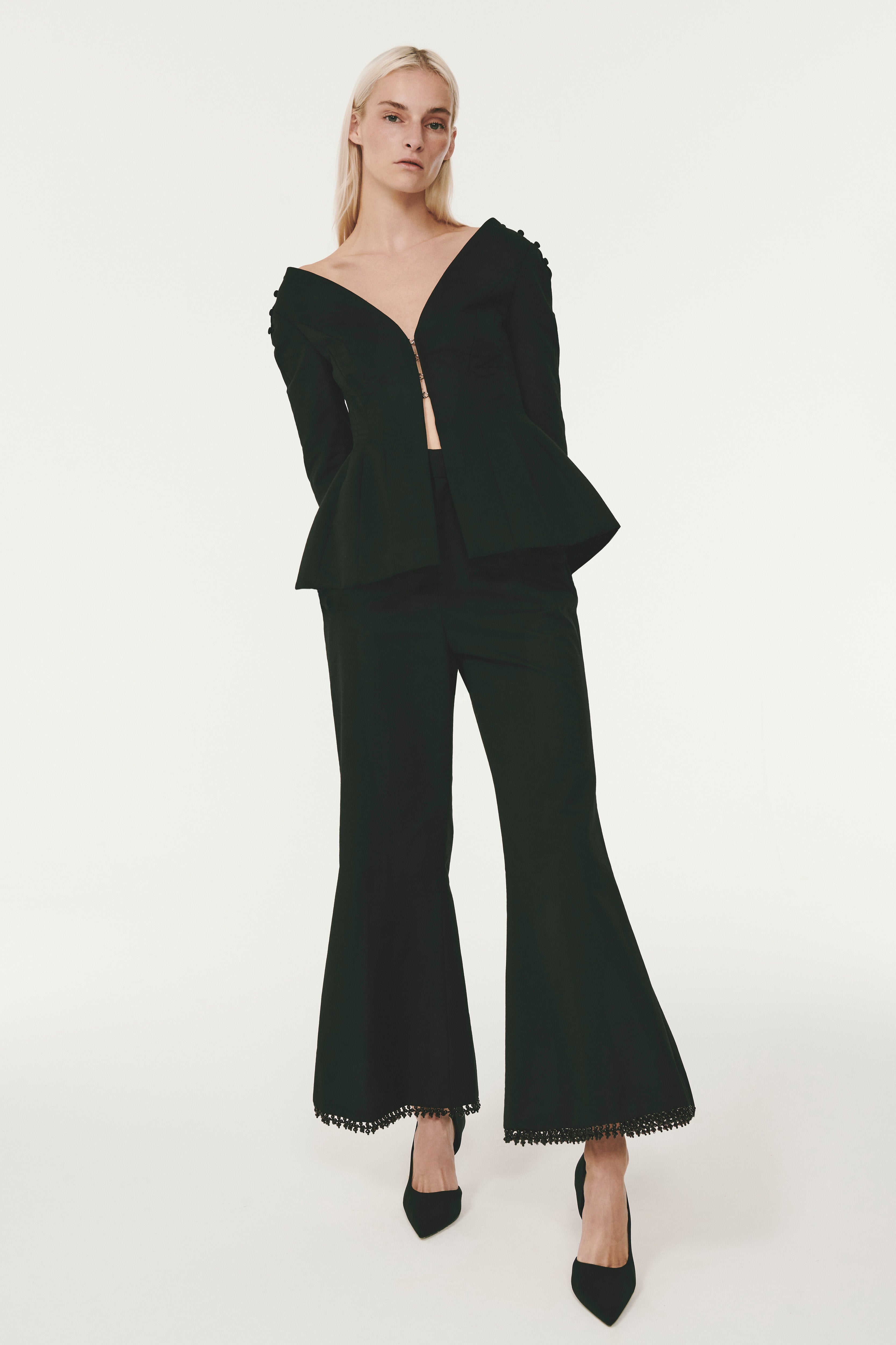 Rosie Assoulin Cut Out Knee Flared Trousers, $1,268